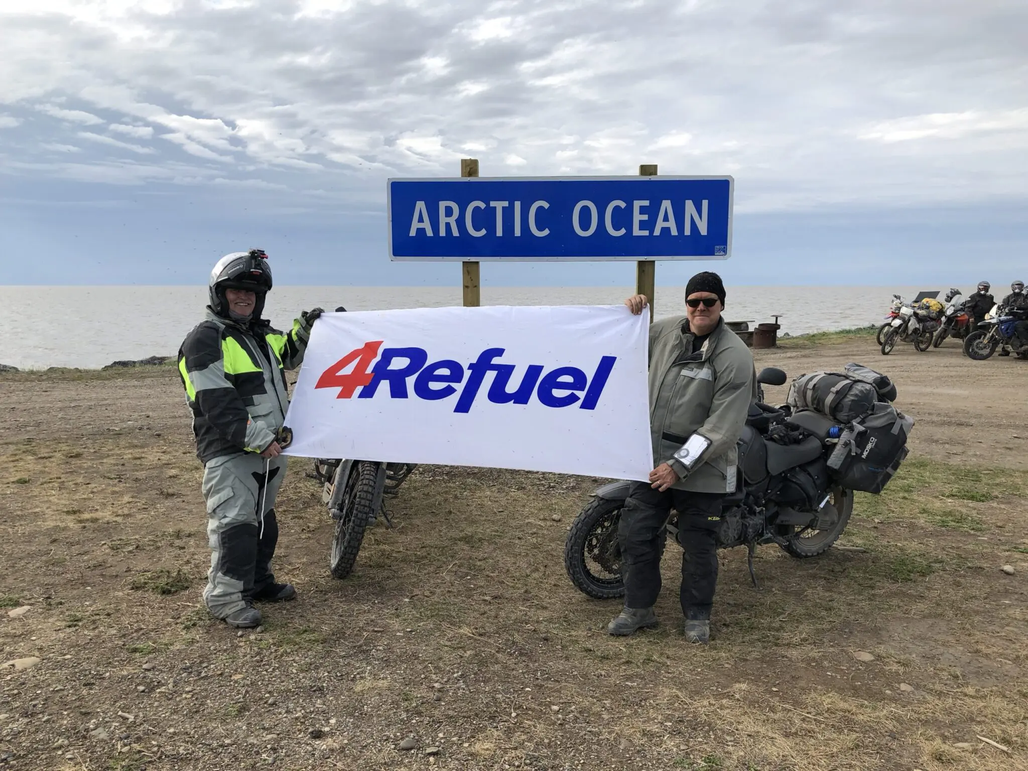 Lamb (left) and colleague Jamie Howe (right) reach the northernmost stop on their journey--the Arctic Ocean--near Tuktoyaktuk, NWT.
